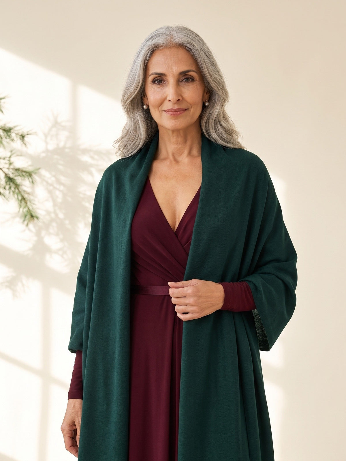 Blythe Evening Wrap in Dark Green, worn over the shoulders