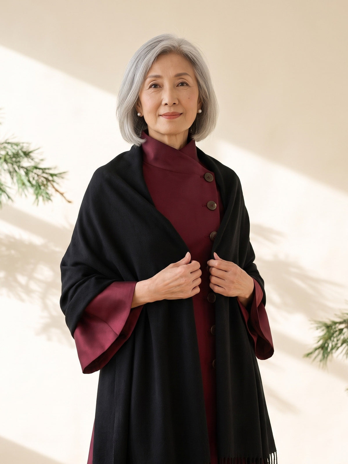 Blythe Evening Wrap in Black, worn over the shoulders