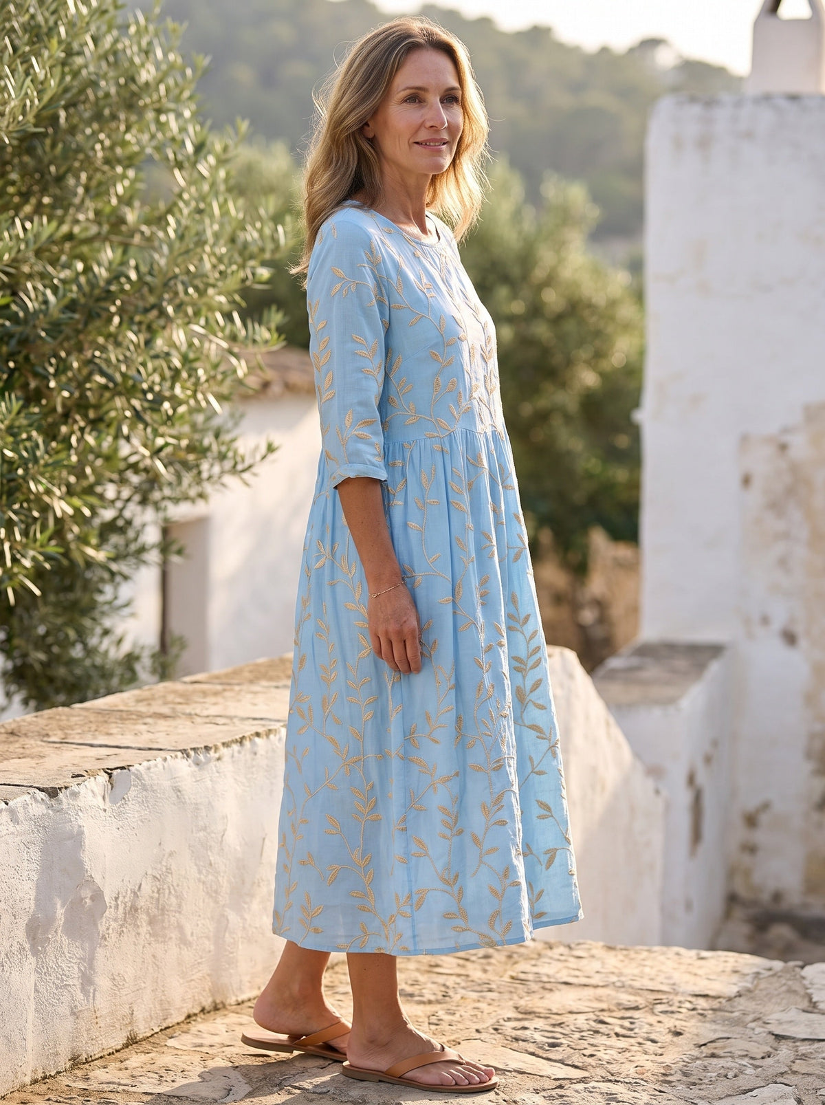 Amalfi Embroidered Midi Dress — full length on a sunlit terrace