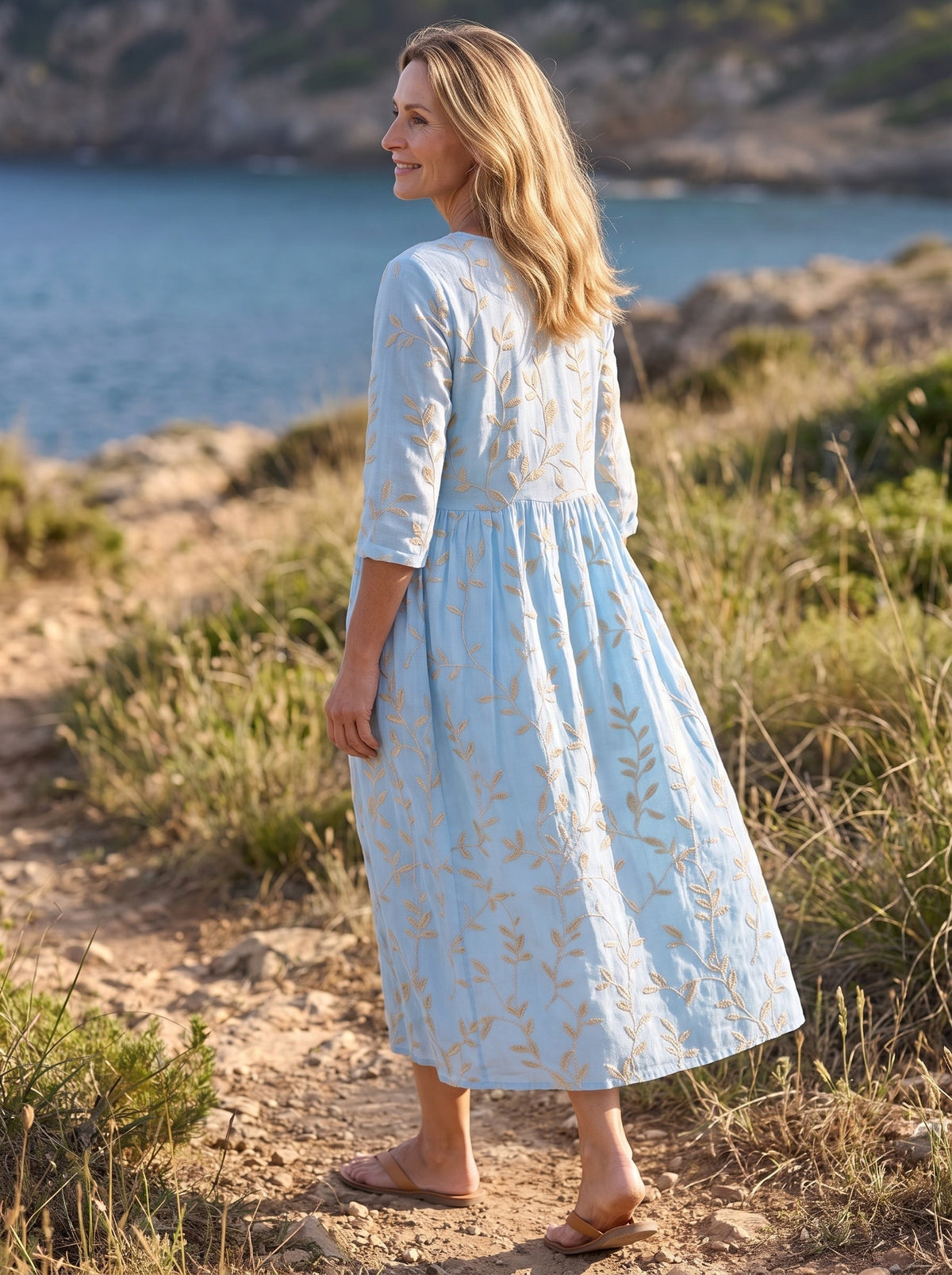 Amalfi Embroidered Midi Dress — back view showing the embroidered skirt