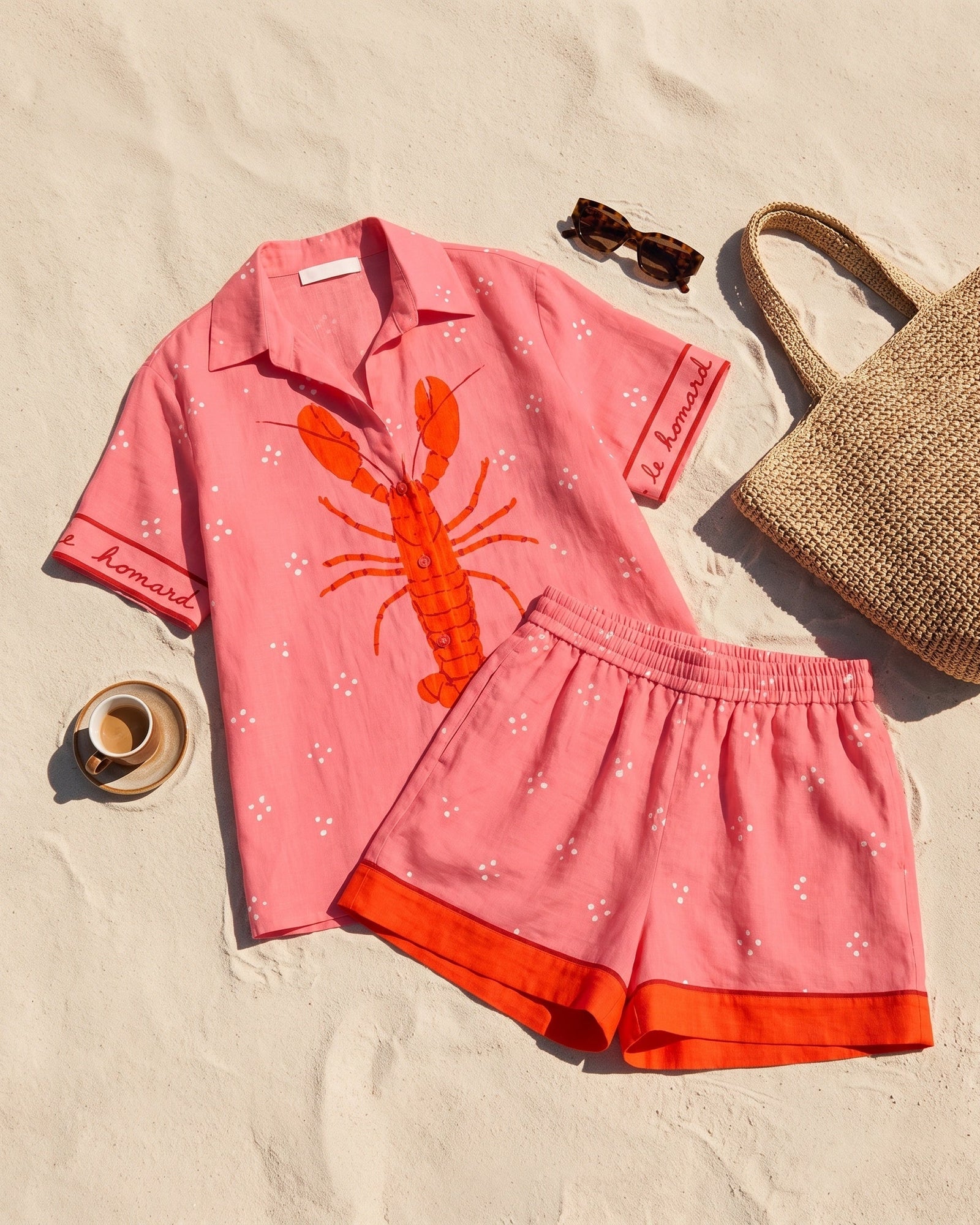 Margaux Matching Set — flat lay of the shirt and shorts on sand