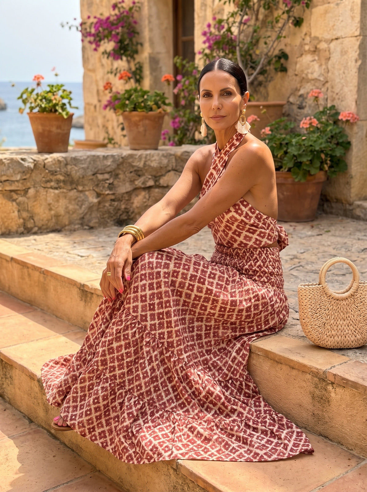 Solana Halter Top and Maxi Skirt Set — seated on stone steps